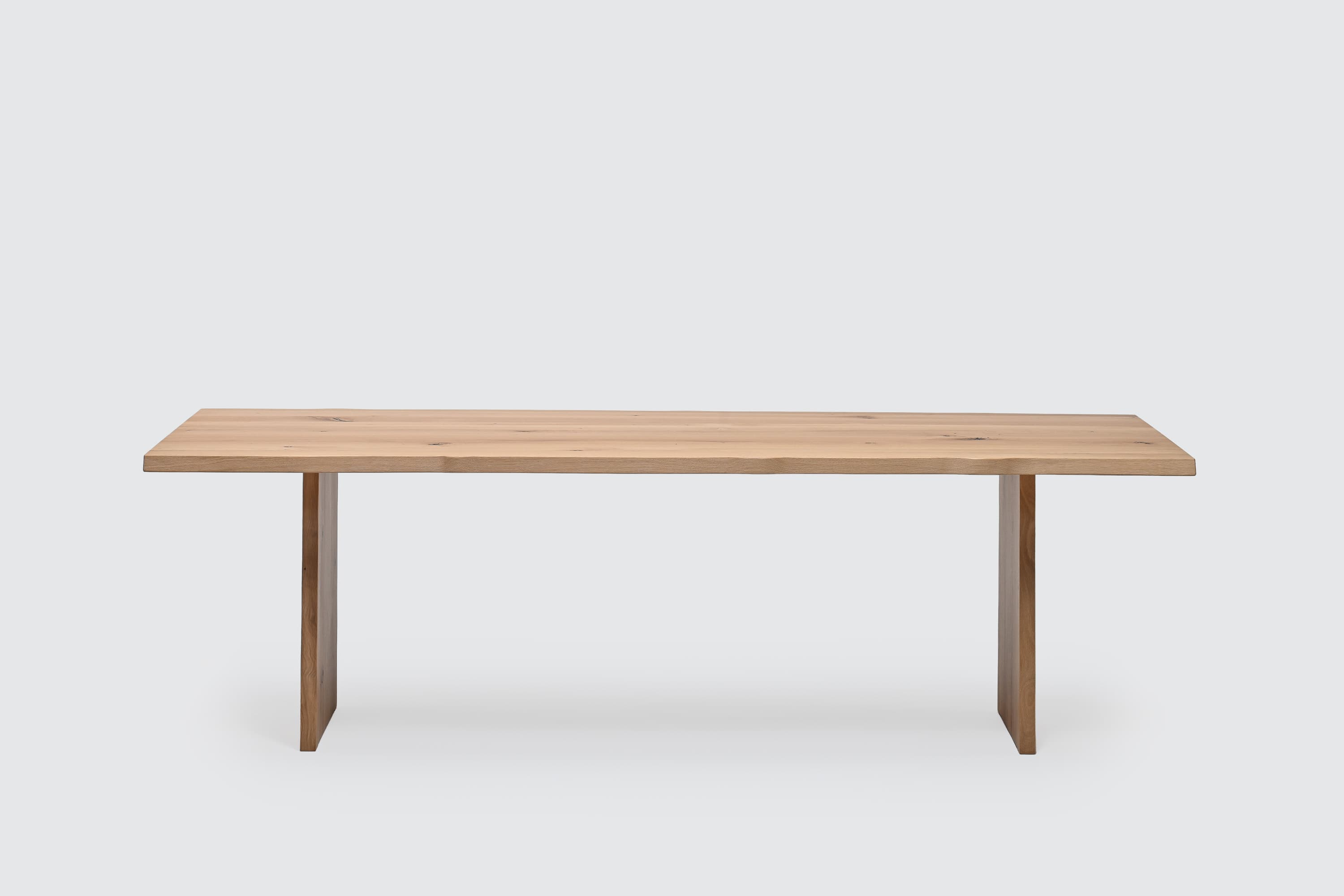 Nexus live-edge oak dining table with wooden live-edge legs